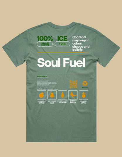 Green t-shirt with text and graphics on a beige background